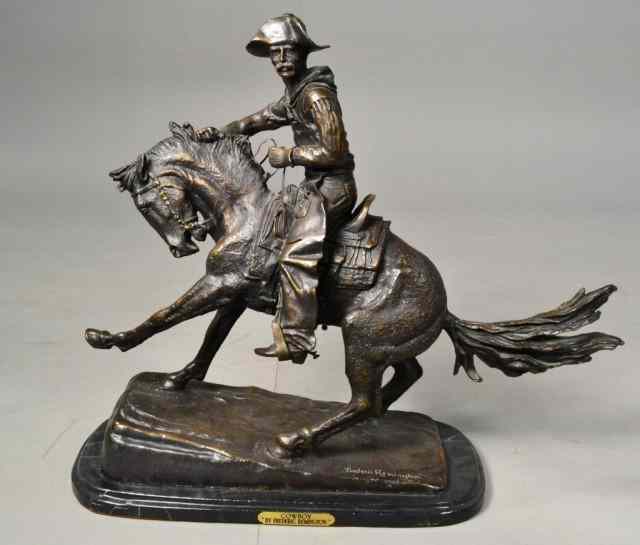 Appraisal: BRONZE SCULPTURE BY FREDERICK REMINGTON''COWBOY'' depicting cowboy breaking a horse