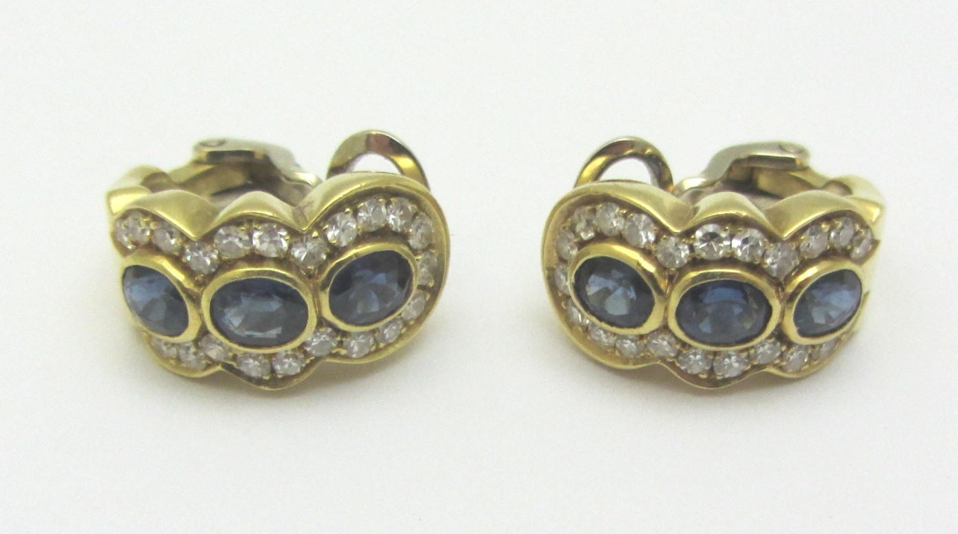 Appraisal: A pair of gold sapphire and diamond set earclips each