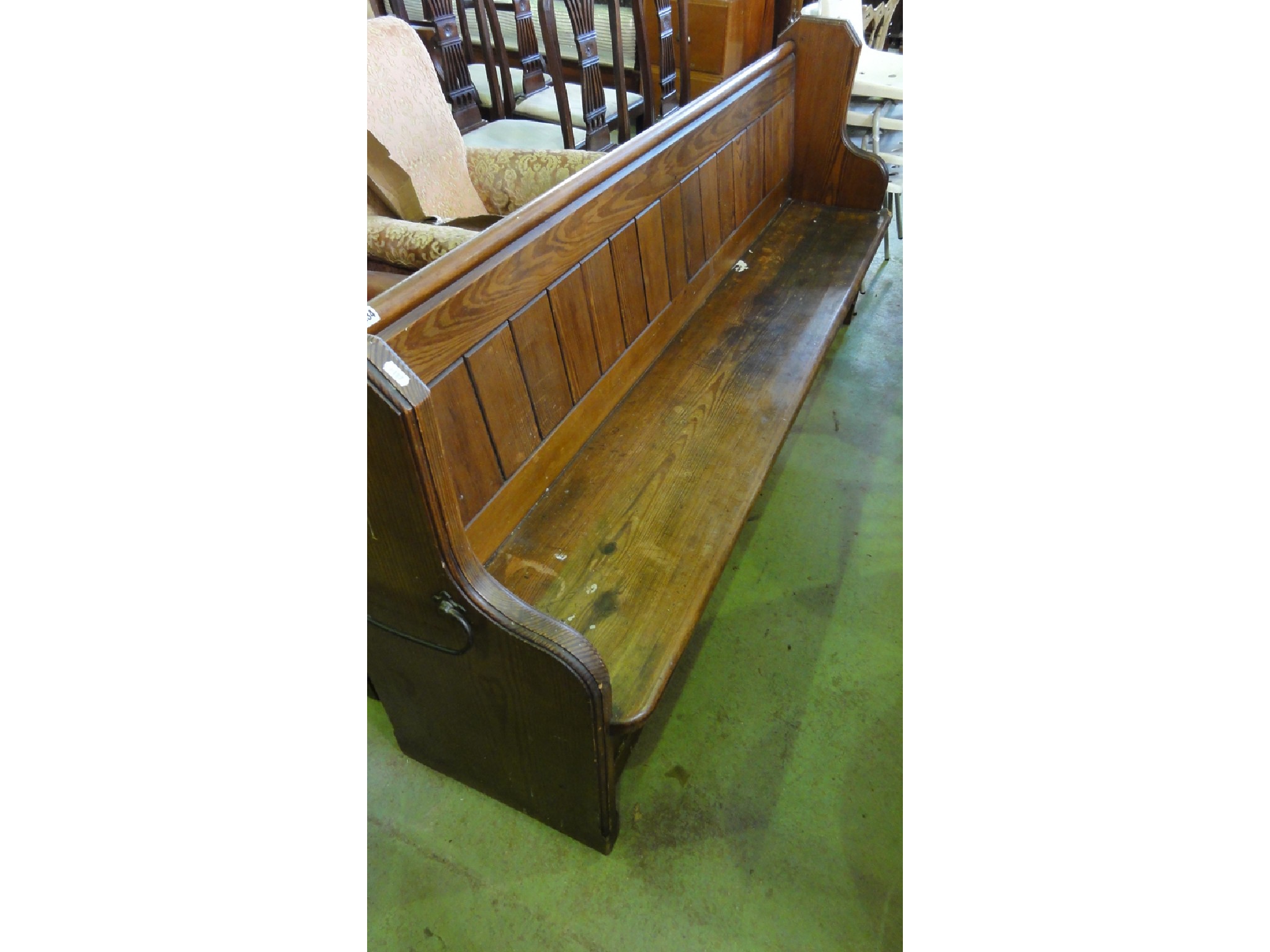 Appraisal: A reclaimed Victorian pitch pine church pew with shaped ends