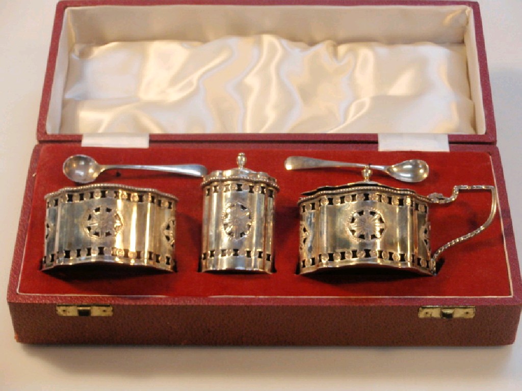 Appraisal: A silver cruet set of cartouche shape with paterae pierced