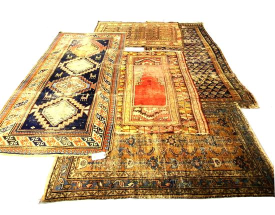 Appraisal: Five Antique rugs Turkish prayer rug red field with yellow