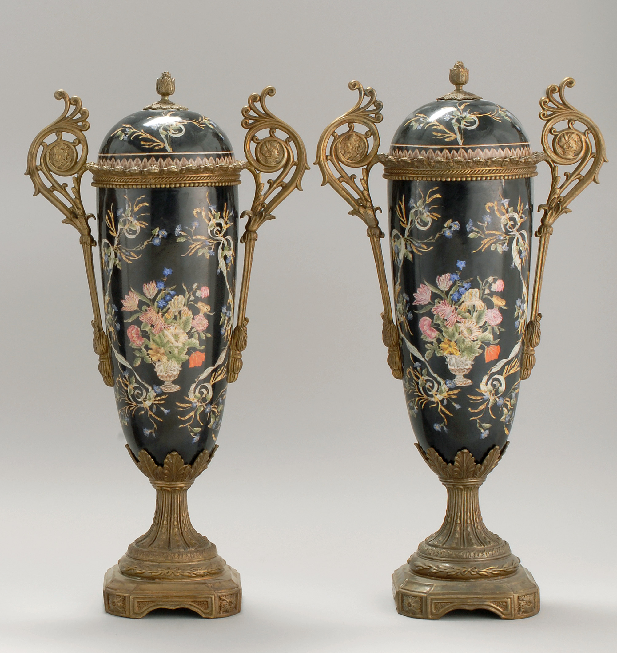 Appraisal: PAIR OF FRENCH BRONZE-MOUNTED PORCELAIN COVERED URNS Late th Early