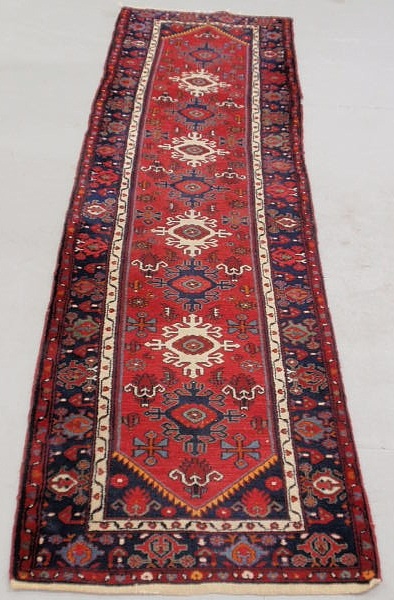 Appraisal: Colorful Persian oriental hall runner with nine center medallions x