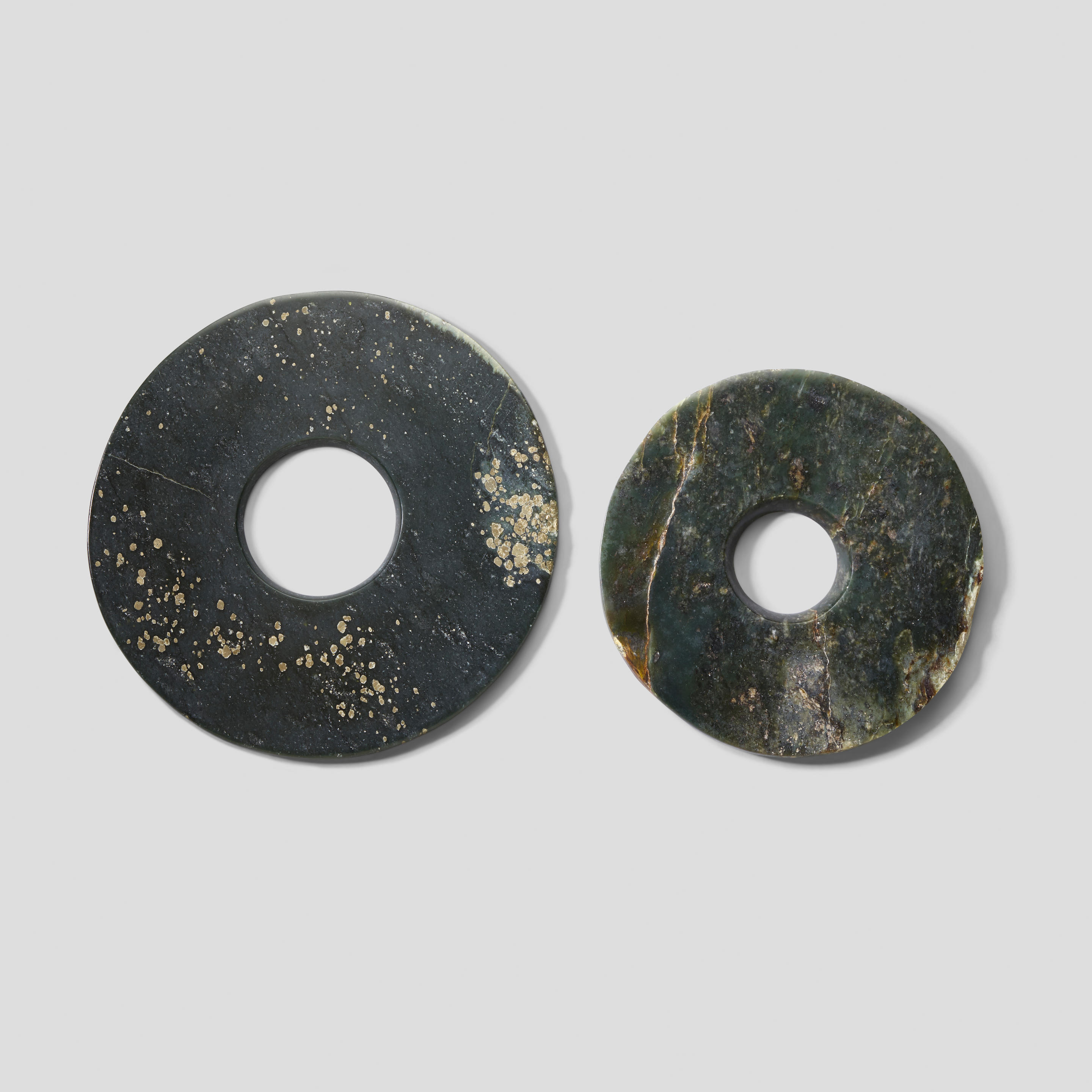 Appraisal: TWO DARK GREEN JADE BI DISCS th century th century