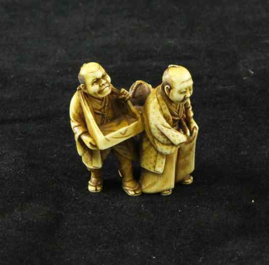 Appraisal: A Japanese stained ivory group of three figures early th