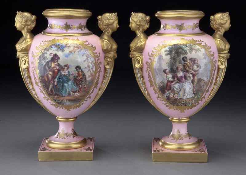 Appraisal: Pr Sevres style pink porcelain vaseswith gilt caryatid handles flanking