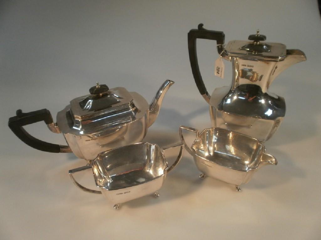 Appraisal: A silver four-piece tea service of rectangular form on scrolled