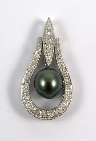 Appraisal: BLACK PEARL AND DIAMOND PENDANT The k white gold pendant