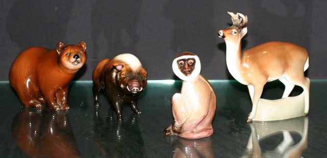 Appraisal: Four Royal Doulton models of animals including a boar HN