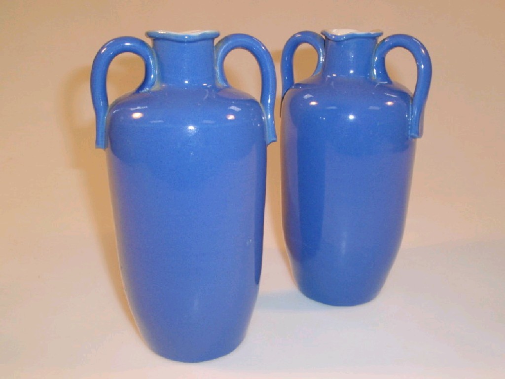 Appraisal: A pair of Royal Doulton blue ground pottery jars of