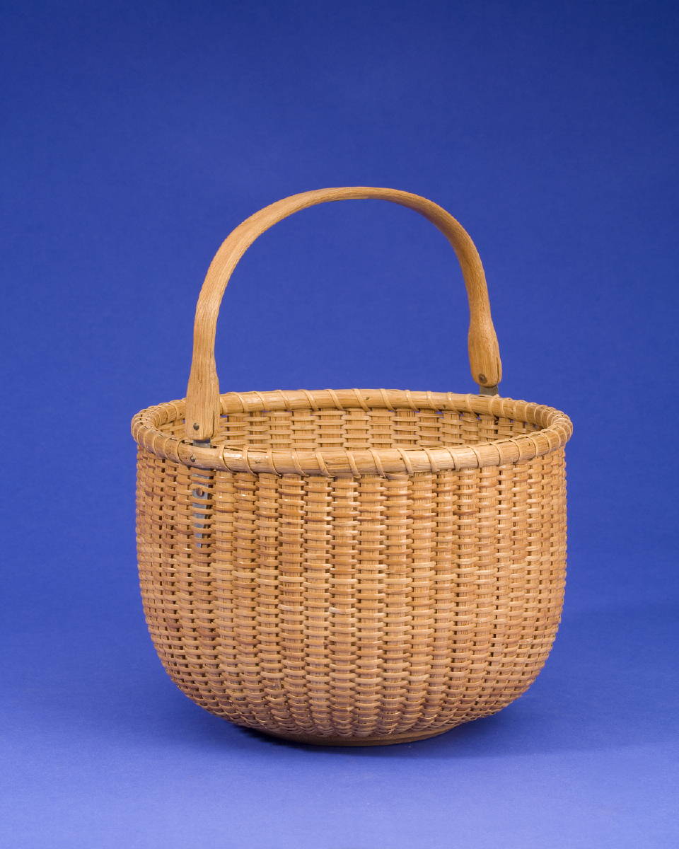 Appraisal: CIRCULAR NANTUCKET LIGHTSHIP BASKET WITH SWING HANDLE BY FERDINAND SYLVARO