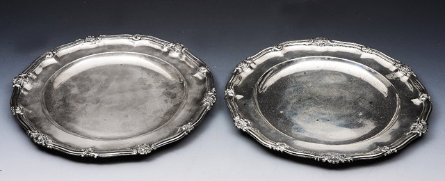 Appraisal: A PAIR OF WILLIAM IV SILVER PLATES with shaped borders