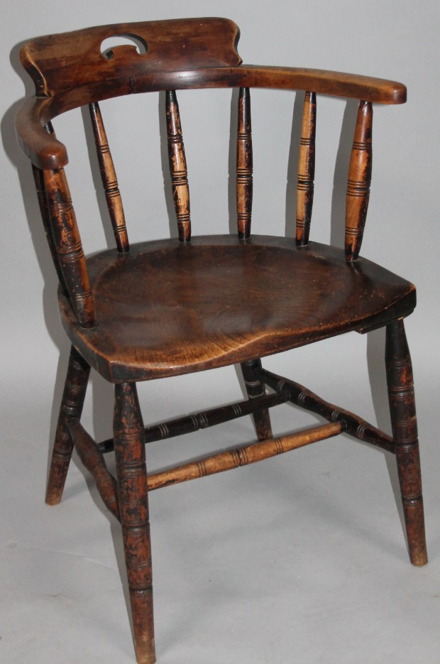 Appraisal: A thC ash and elm club chair with a part