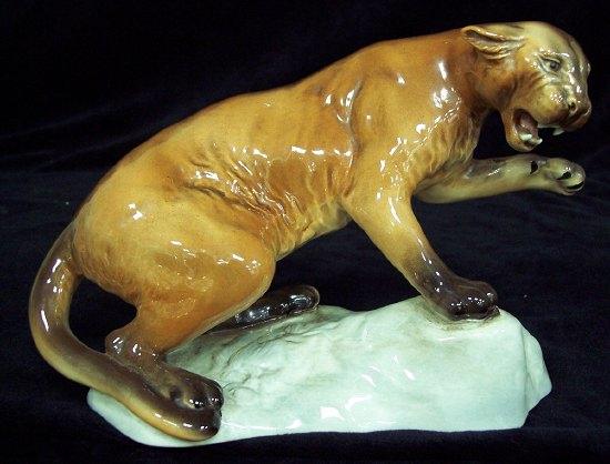 Appraisal: A Beswick model of a puma on a rock impressed