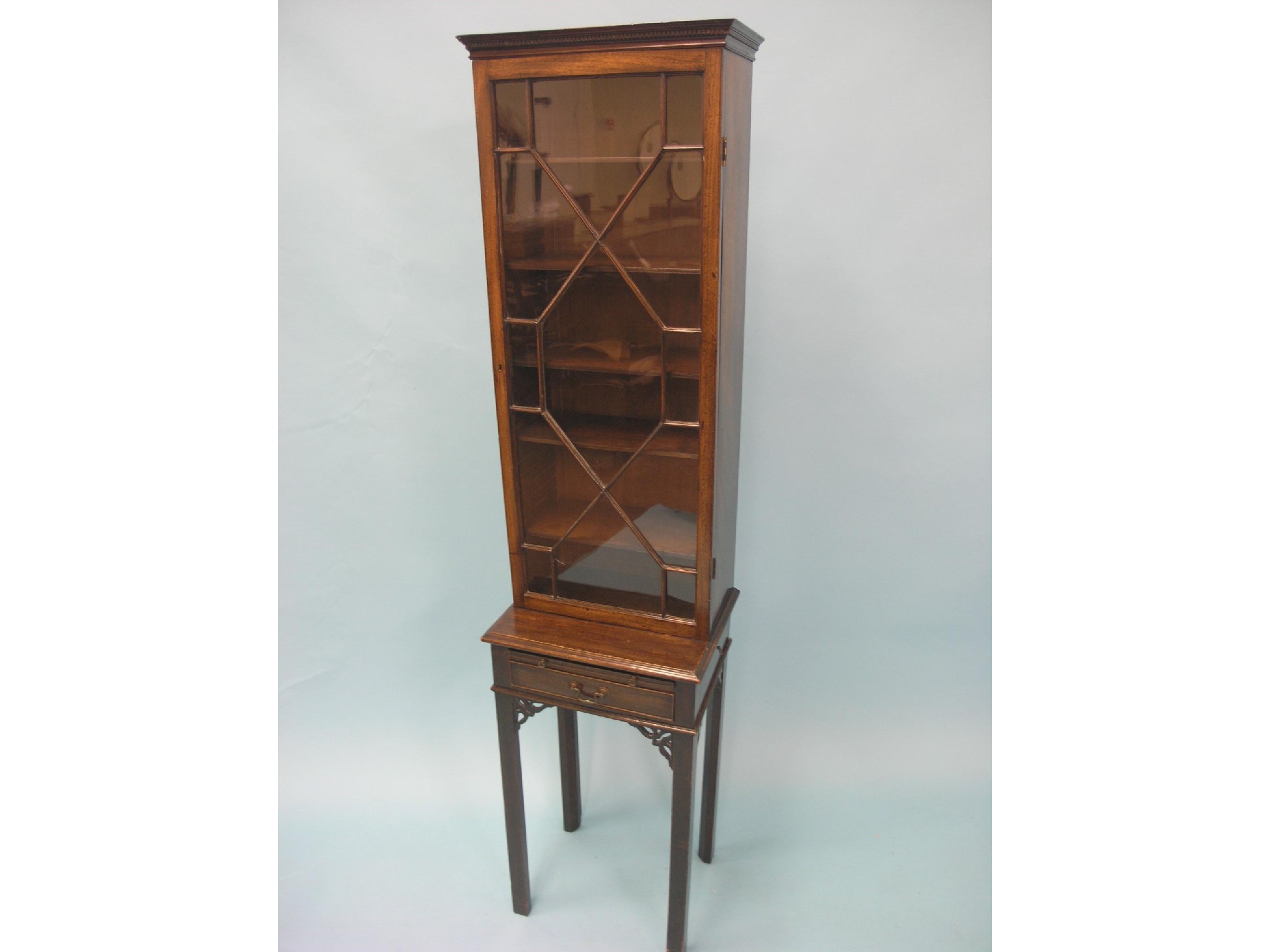 Appraisal: A Victorian Chippendale mahogany display cabinet unusually narrow single astragal-glazed