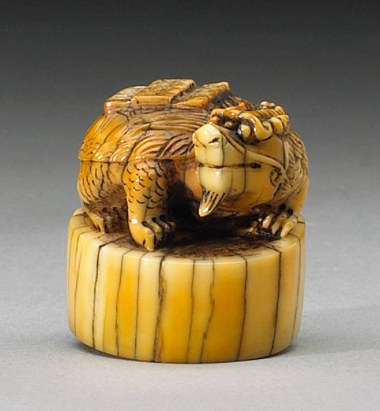 Appraisal: Chinese Ivory Of oval section topped with a triple-horned crunching