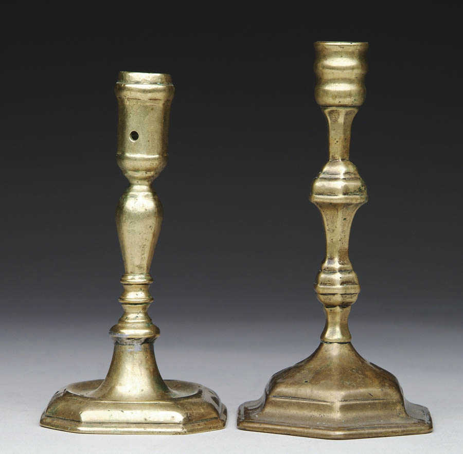 Appraisal: TWO EARLY BRASS CANDLESTICKS th Century - h with cut