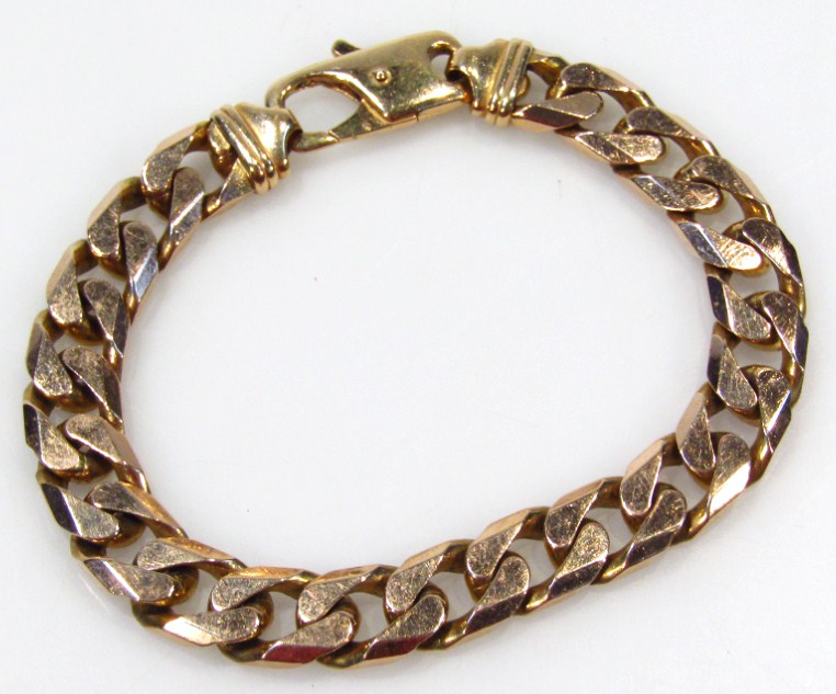 Appraisal: A heavy link bracelet with shaped clasp yellow metal marked