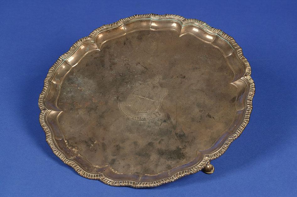 Appraisal: A GEORGE III IRISH SALVER of shaped circular form with