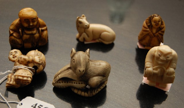 Appraisal: A COLLECTION OF JAPANESE IVORY AND BONE NETSUKE Comprising four