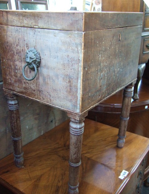 Appraisal: A George III mahogany cellerette the rectangular lift top enclosing