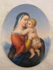 Appraisal: An oval porcelain plaque of the Madonna and Child probably