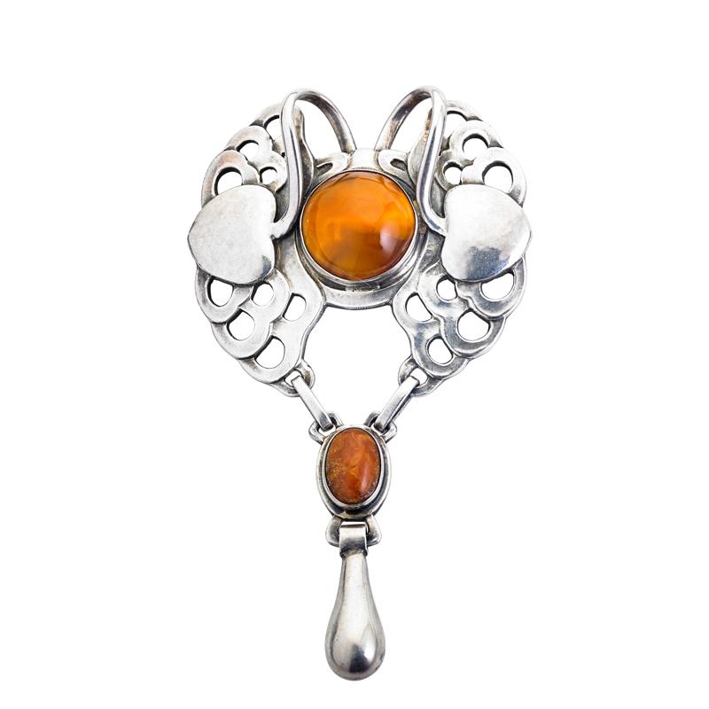 Appraisal: EARLY GEORG JENSEN SILVER AND AMBER BROOCH silver designed by