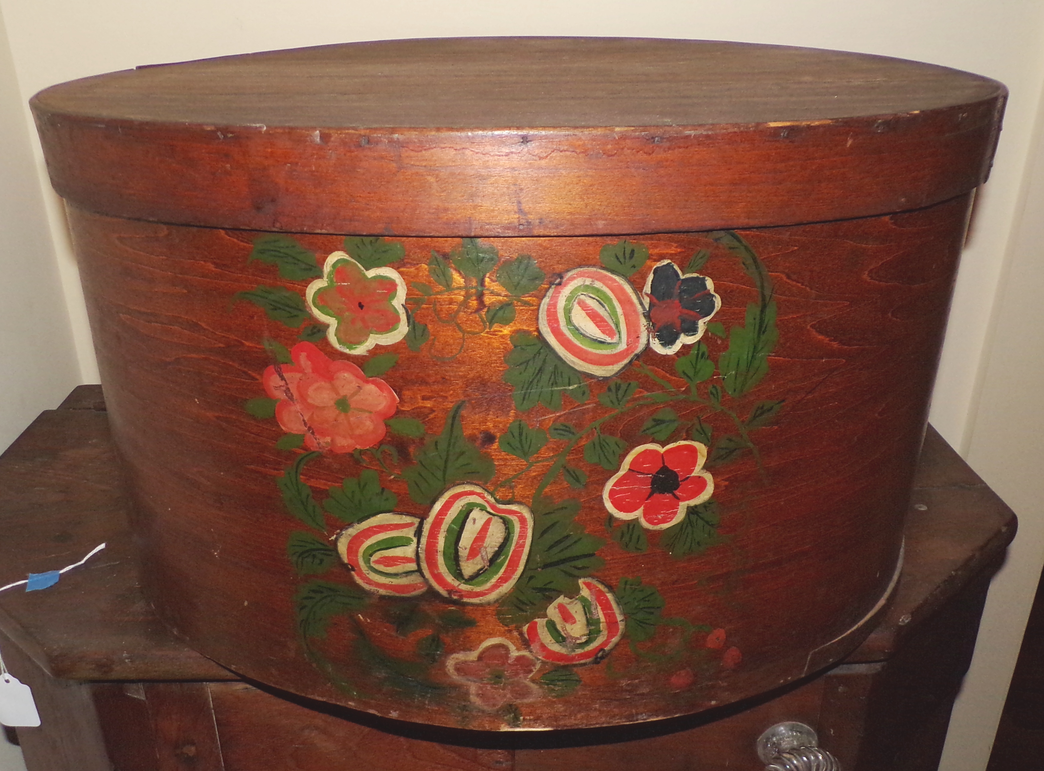 Appraisal: Oval pantry box with hand-painted floral decoration x x ''