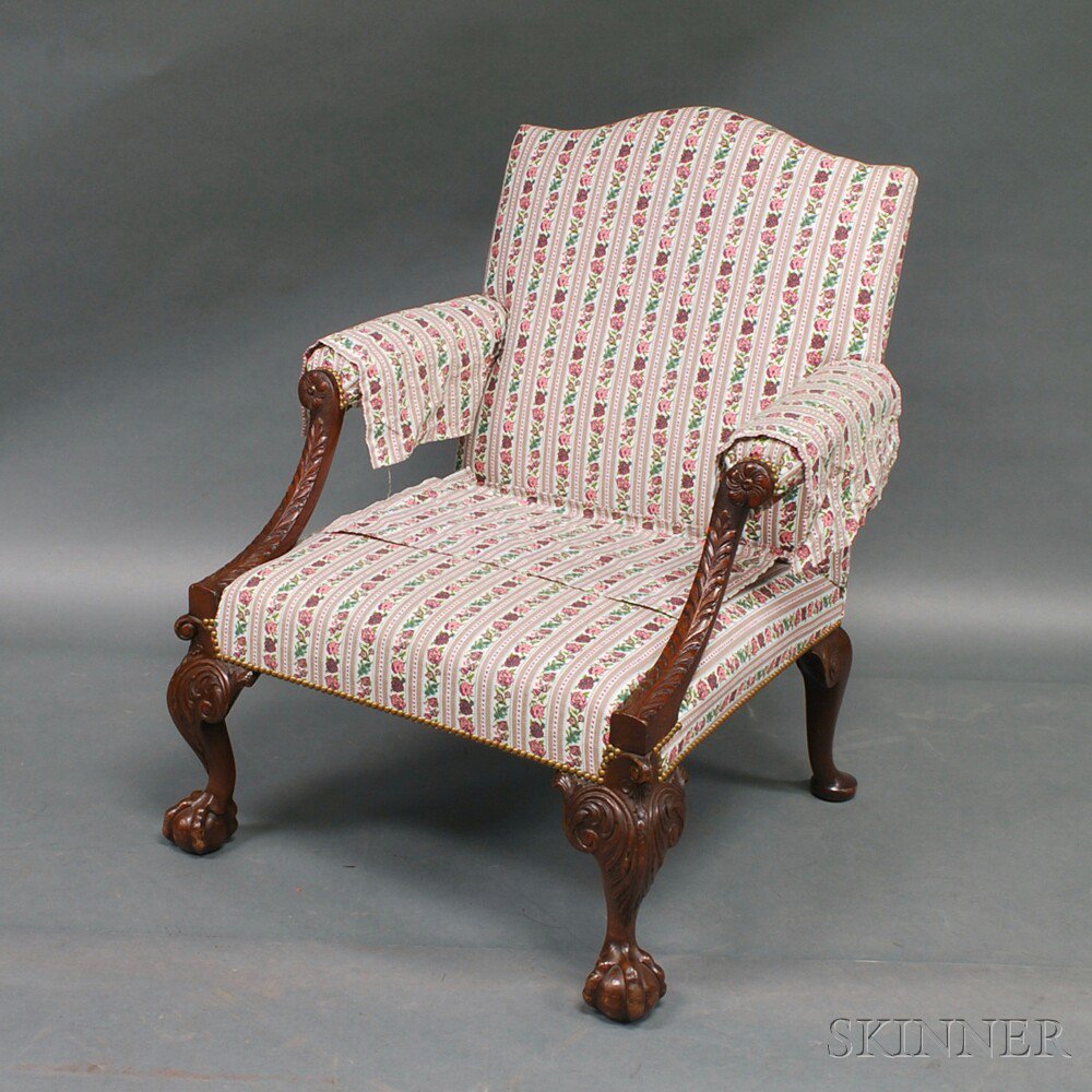 Appraisal: Georgian-style Mahogany Lolling Chair the overupholstered arms with carved rosettes