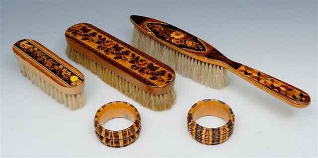 Appraisal: TWO TUNBRIDGEWARE NAPKIN RINGS of turned form with striped decoration