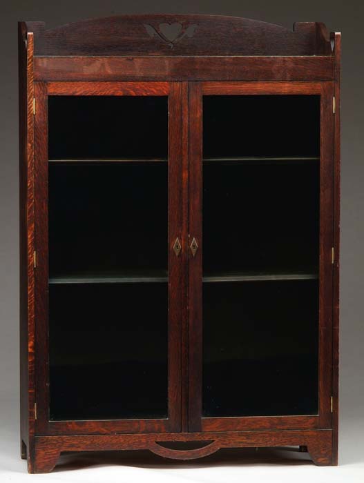 Appraisal: MISSION OAK STYLE TWO DOOR BOOKCASE Gallery type top with