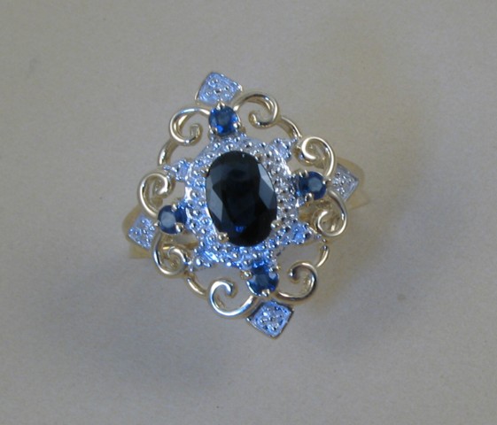 Appraisal: SAPPHIRE AND DIAMOND RING with appraisal k yellow and white