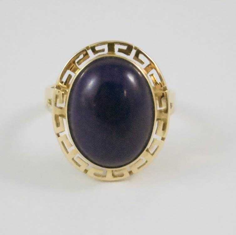 Appraisal: LAPIS LAZULI AND FOURTEEN KARAT GOLD RING bezel set with