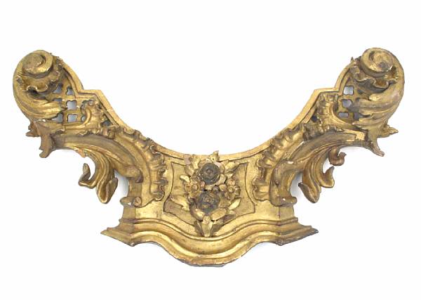 Appraisal: A Continental Rococo style giltwood pediment fragment together with a