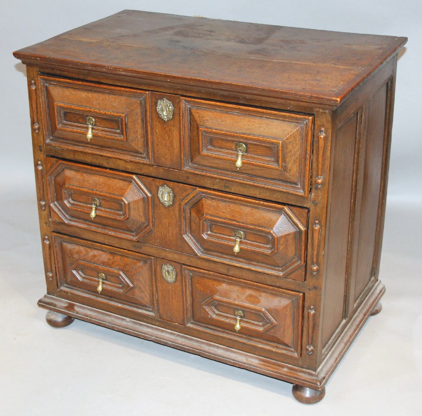 Appraisal: A principally thC oak chest with three long carved inverted