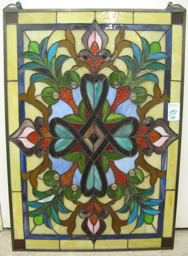 Appraisal: TWO STAINED AND LEADED GLASS WINDOW PANELS the first in