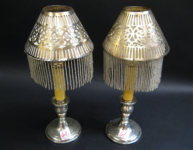 Appraisal: PAIR OF AMERICAN STERLING SILVER CANDLE LAMPS having pierced silver