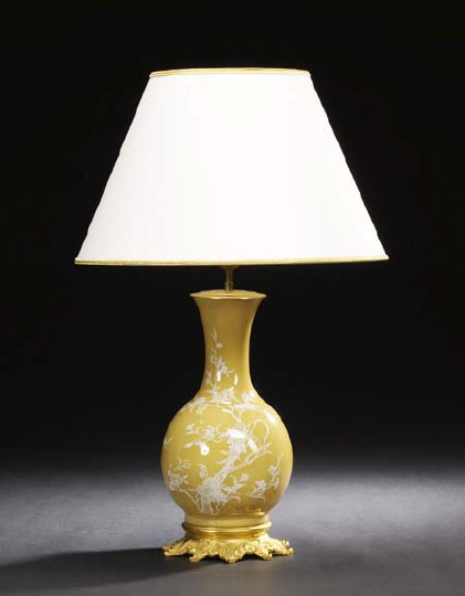 Appraisal: Napoleon III Gilt-Lacquered Brass-Mounted Caramel-Glazed Porcelain Carcel Lamp in the