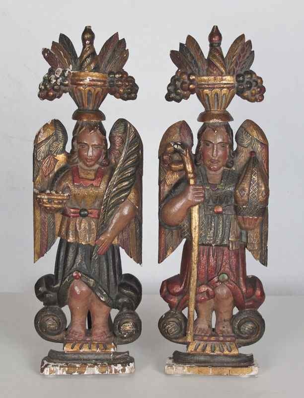 Appraisal: PAIR OF RUSSIAN RELIGIOUS CARVINGS Carved and polychrome painted winged