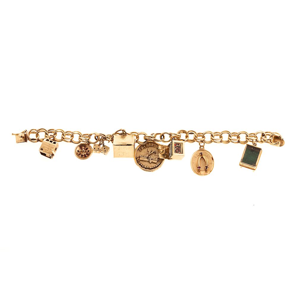 Appraisal: A Ladies Las Vegas Themed Charm Bracelet in K K