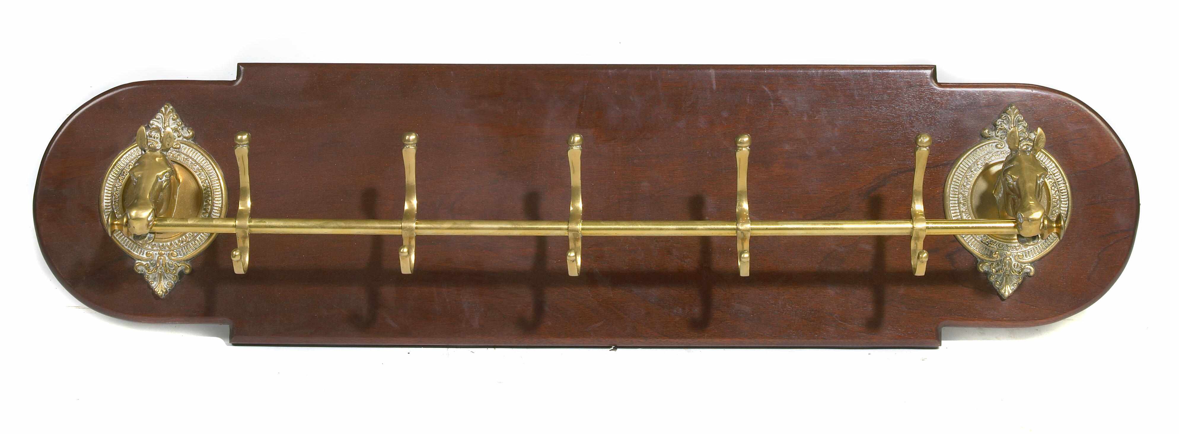 Appraisal: A brass and mahogany crop and hat rack height in