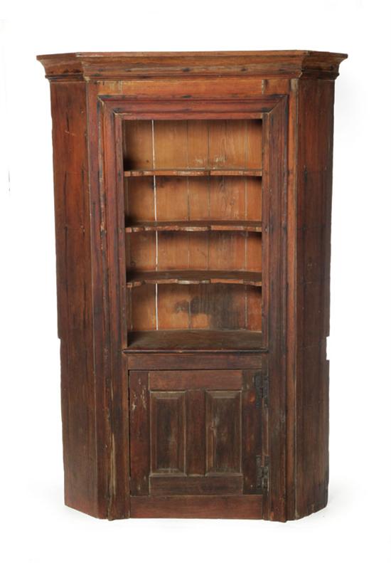 Appraisal: BARREL-BACK CORNER CUPBOARD New England th century pine One-piece the