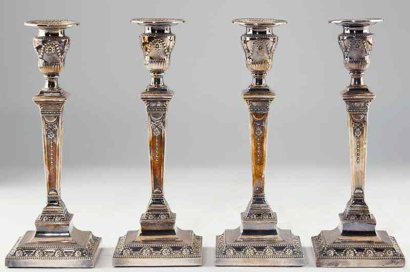 Appraisal: Set of Four Silverplate Candlesticks circa in the Neoclassical style