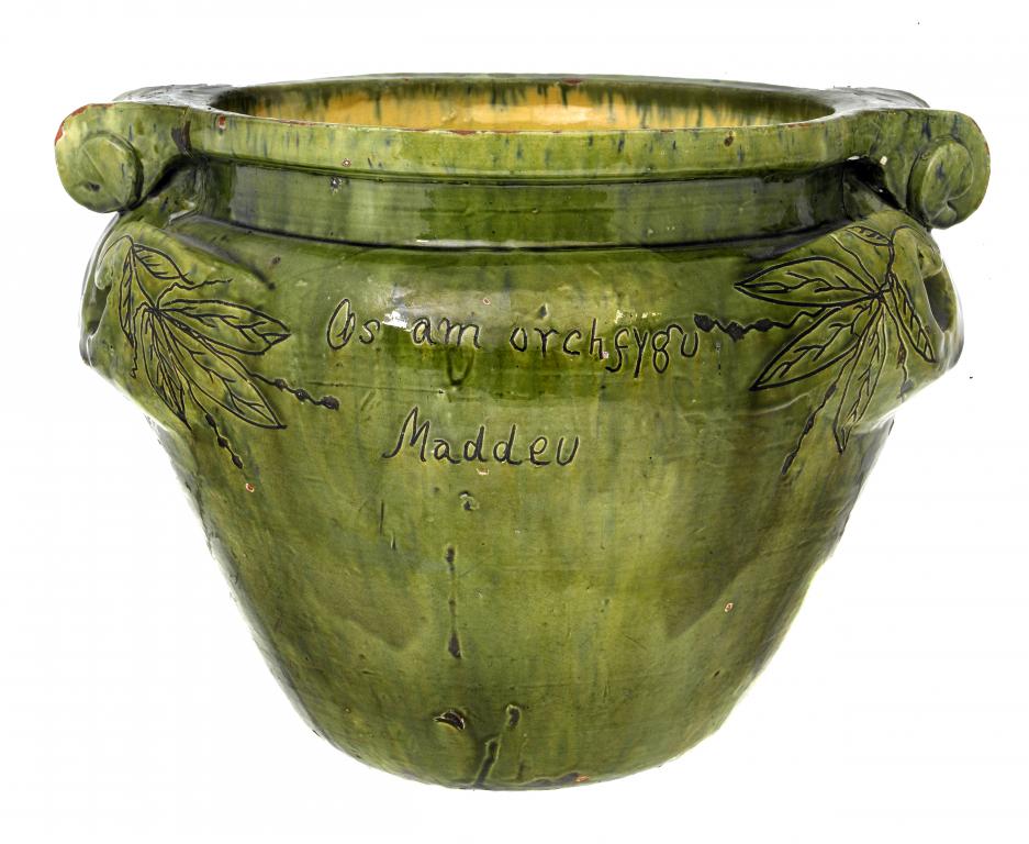 Appraisal: A EWENNY SLIPWARE JARDINIERE covered in green over ochre slip