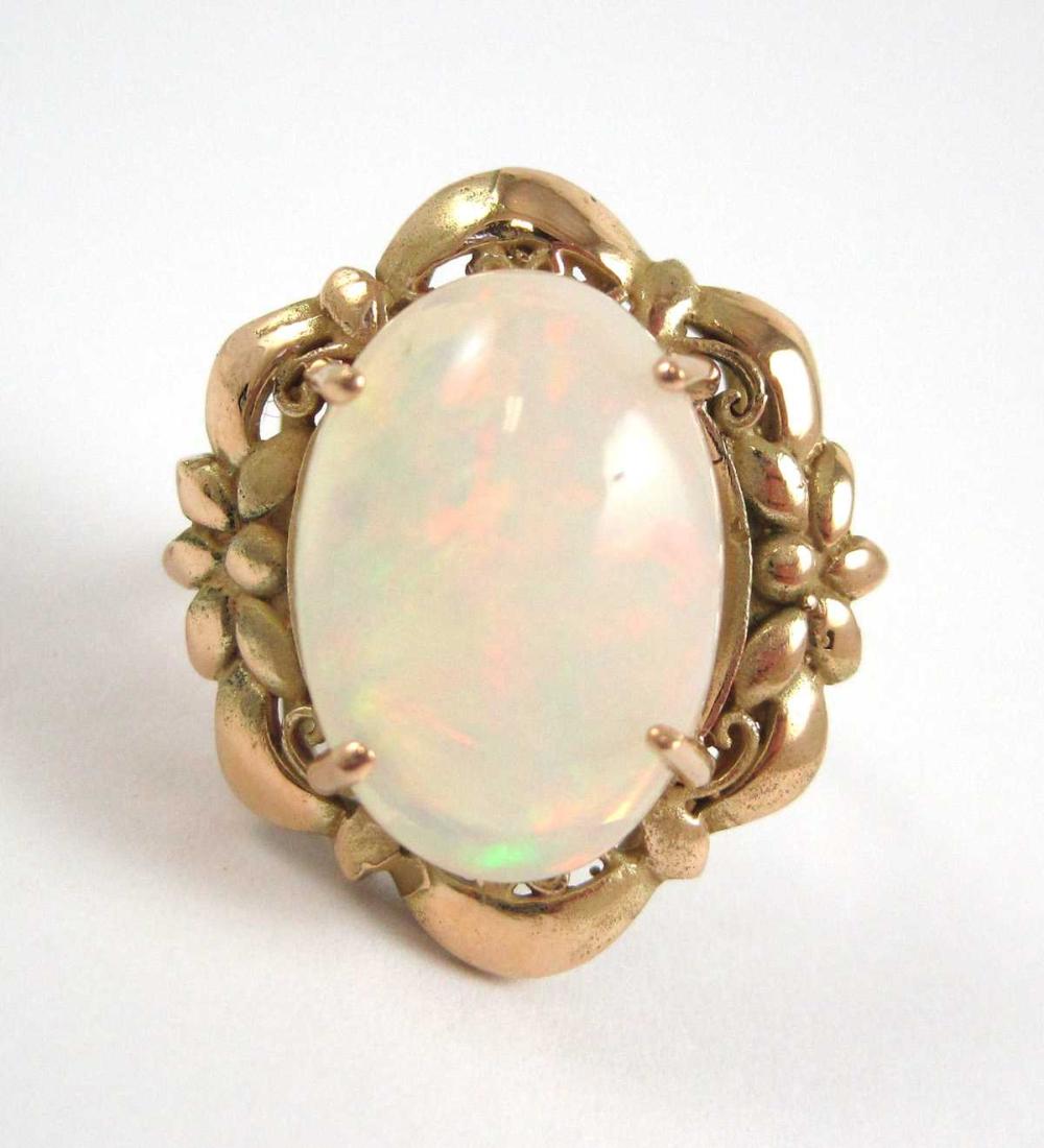 Appraisal: OPAL AND FOURTEEN KARAT GOLD RING prong set with an