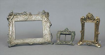 Appraisal: Three Art Nouveau Picture Frames Brass patinated metal and carved