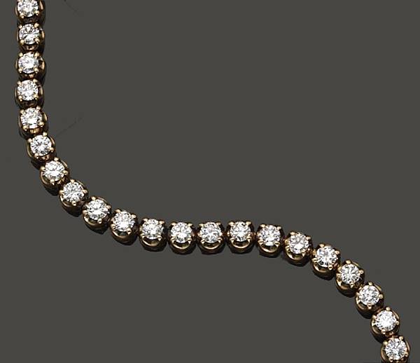 Appraisal: A diamond and k gold tennis bracelet estimated total diamond