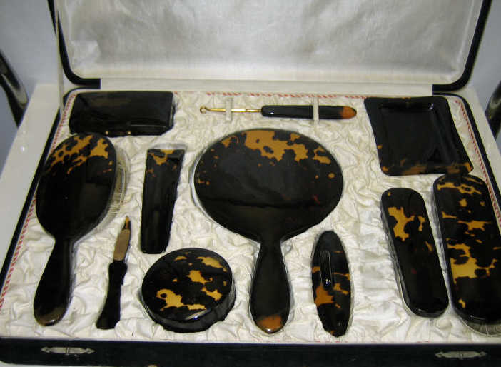 Appraisal: TORTOISESHELL DRESSER SET Eleven-piece including brushes mirrors boxes and other