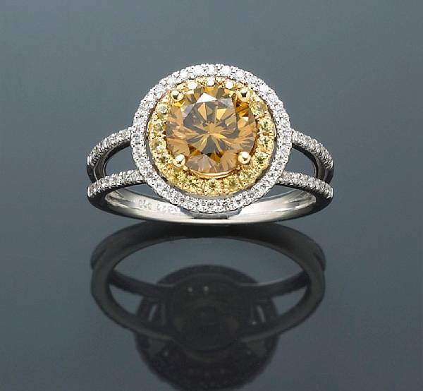 Appraisal: A colored diamond yellow sapphire and diamond ring centering a