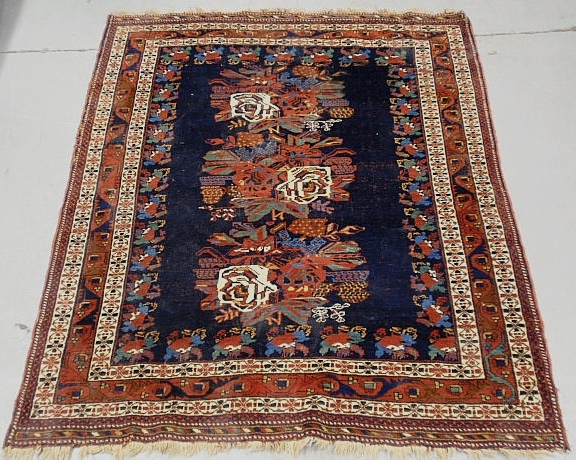 Appraisal: - Tribal oriental center hall carpet with blue field and